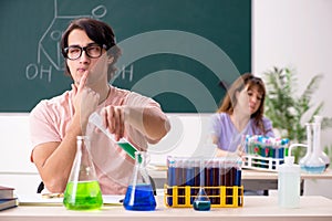 The two chemists students in classroom