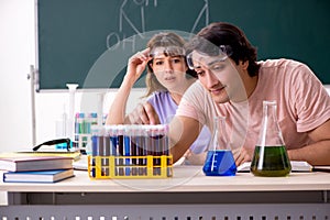 The two chemists students in classroom