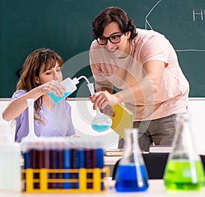 Two chemists students in classroom