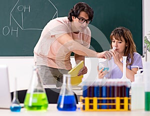 Two chemists students in classroom