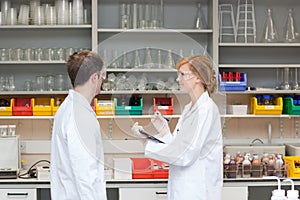 Two chemists in their laboratory