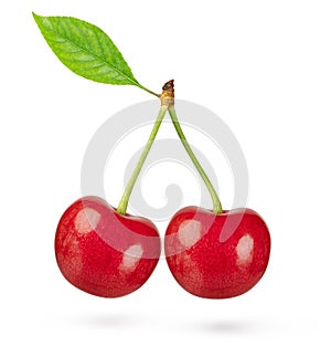 Two cherries with leaf isolated on white background. Clipping path