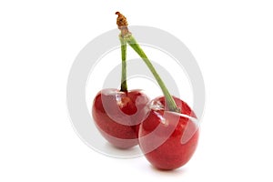 Two cherries side view