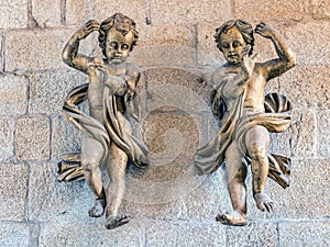 Two cherubs in Romanesque Cathedral of Porto, Portugal photo