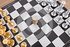 The two chess pieces placed on the chess board and the euro coin in the middle ready to be contested