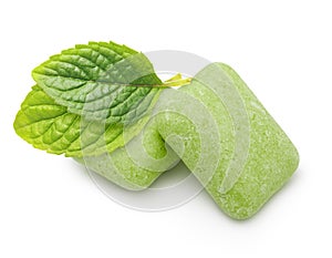 Two chewing gum with mint leaves