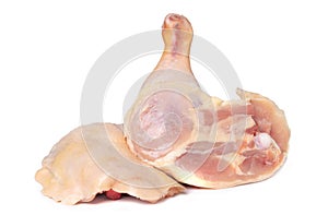 Two chicken legs on a white background, close-up