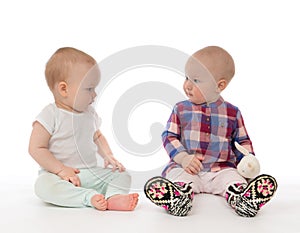 Two child baby girls toddlers sitting