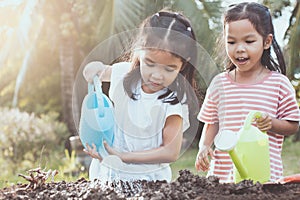 Two children asian little girl having fun to prepare soil