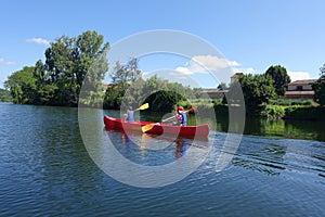 Two children canoing on the River lot photo