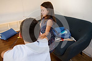 Children studying together at home