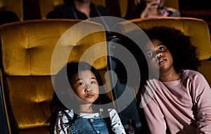 Two children having fun and enjoy watching movie