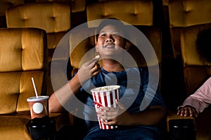 Two children having fun and enjoy watching movie