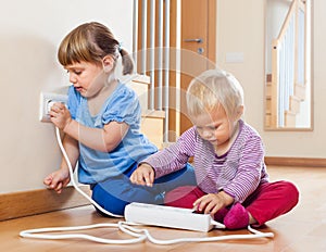 Two children playing with electricity