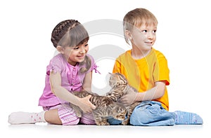 Two children playing with kitten