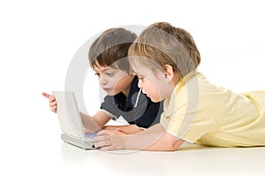 Two children playing with the laptop