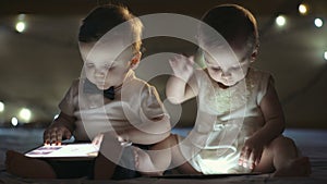 Two children playing with a tablet
