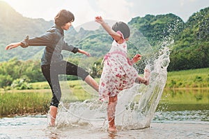 two children playing water