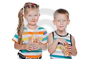 Two children with popcorn