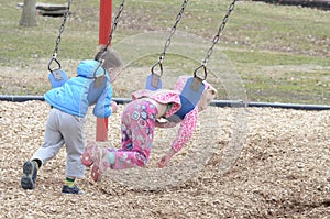 Two children on swings