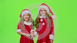 Two children are talking about the celebration of the new year. Green screen