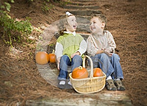 Two Children on Wood Steps with Pumpkins Whisperi