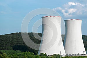 Two chimneys of nuclear power plant near the road