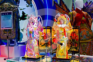 Two Chinese Beijing opera figurine on display