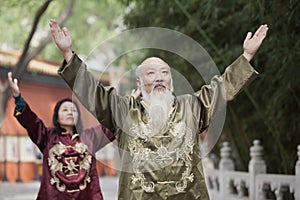 Two Chinese People Practicing Tai Ji