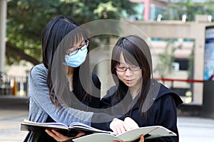 Two Chinese university students on campus