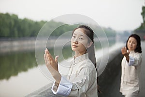 Two Chinese Women Practicing Tai Ji