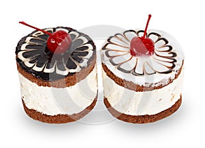 Two chocolate cakes with cherry