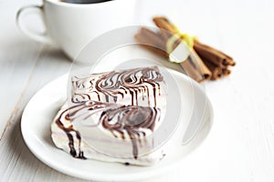 Two chocolate cakes on the plate and coffee cup