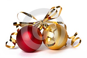 Two Christmas baubles with gold ribbon bow on white background