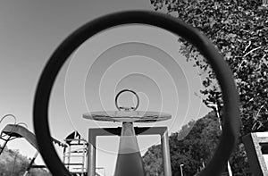 Two circles of teeter totter on a playground.