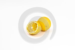 Two citrus fruits a hybrid of orange and lemon yellow color on a white background