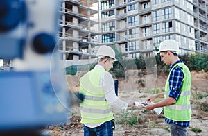 Two civil engineer with drawings