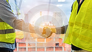 Two civil engineers having handshake together