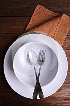 Two clean plates and cutlery