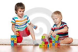 Two clever boys with blocks