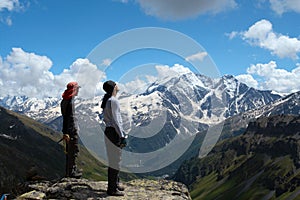 Two climbers looking at the mountains