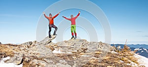 Two climbers on top of the mountain.