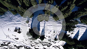 Two climbers walk along a snowy ridge