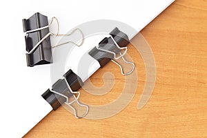 Two clips stapling papers