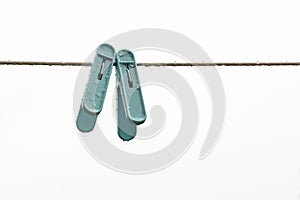 Two cloth clips on a clothesline on rainy day