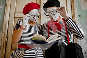 Two clowns in glasses, mime artists, parody comedy