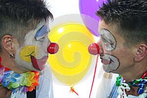 Two clowns with red nose