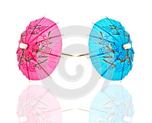Two cocktail umbrella, blue and pink