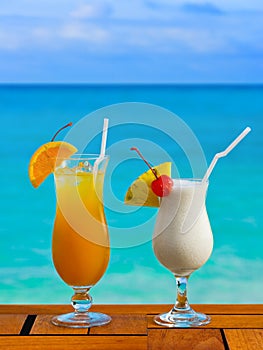 Two cocktails on table at beach cafe