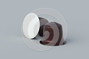 Two coffee capsules on gray background. Modern decaf pods for machine.